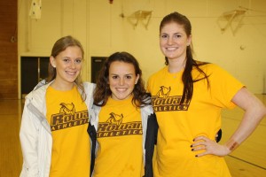 From left: Sarah Rosenberg, Maddie Williscroft and Erin Keegan pose together during National Girls and Women in Sports Day. All three play on a Rowan University sports team. -Jessica Kovalick for The Whit. 